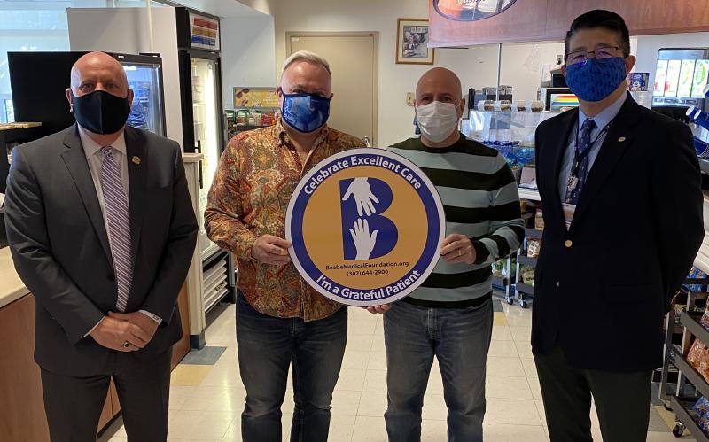 Joe Zuber and Darryl Ciarlante celebrate the excellent care and support they both received from Beebe team members during Darryl’s 40-day battle with COVID-19. Shown are (l-r) Beebe Medical Foundation President Tom Protack, Joe, Darryl, and Beebe Healthcare CEO and President Dr. David Tam. SUBMITTED PHOTO